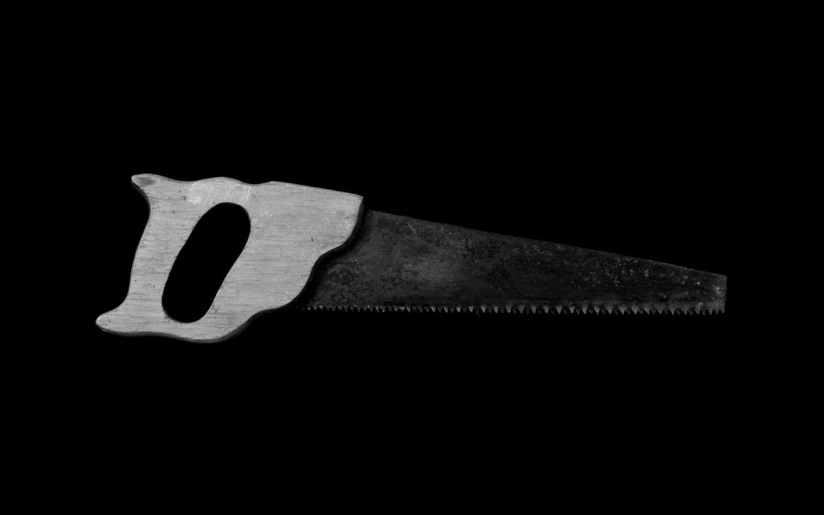Hand saw for woodworking on a dark background - EQUIPE Egypt